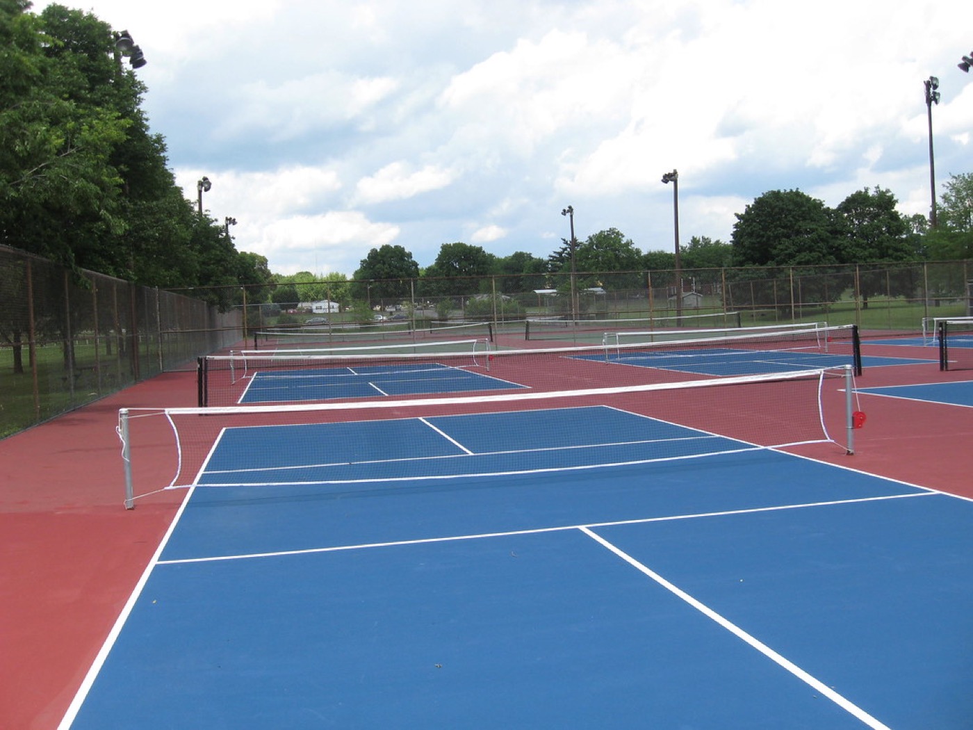 Outdoor pickleball courts on a bright day